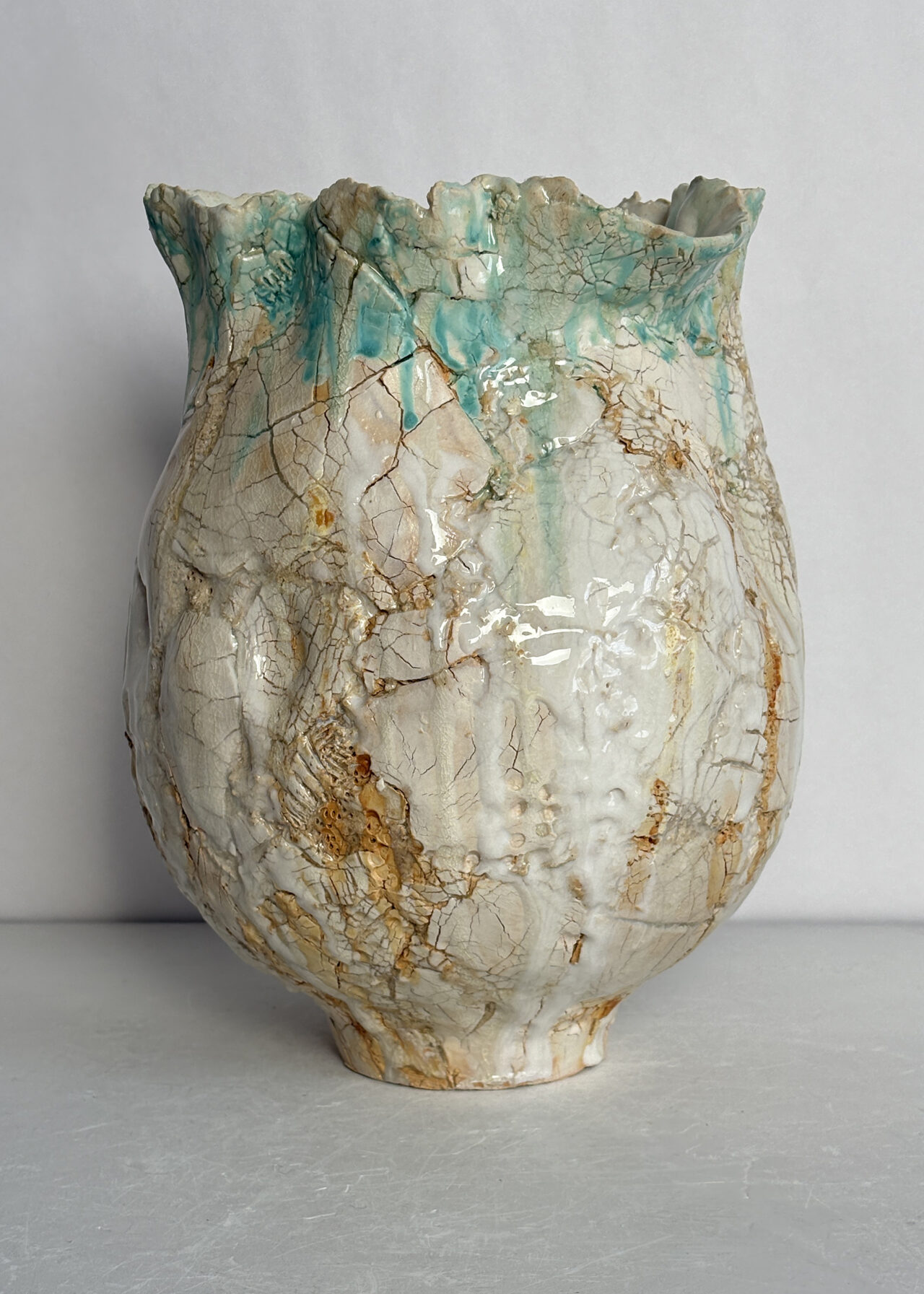 Contemporary stoneware ceramic vessel with cracked glaze and textured surface, sculptural ceramics by Rebeccah Pailes-Friedman