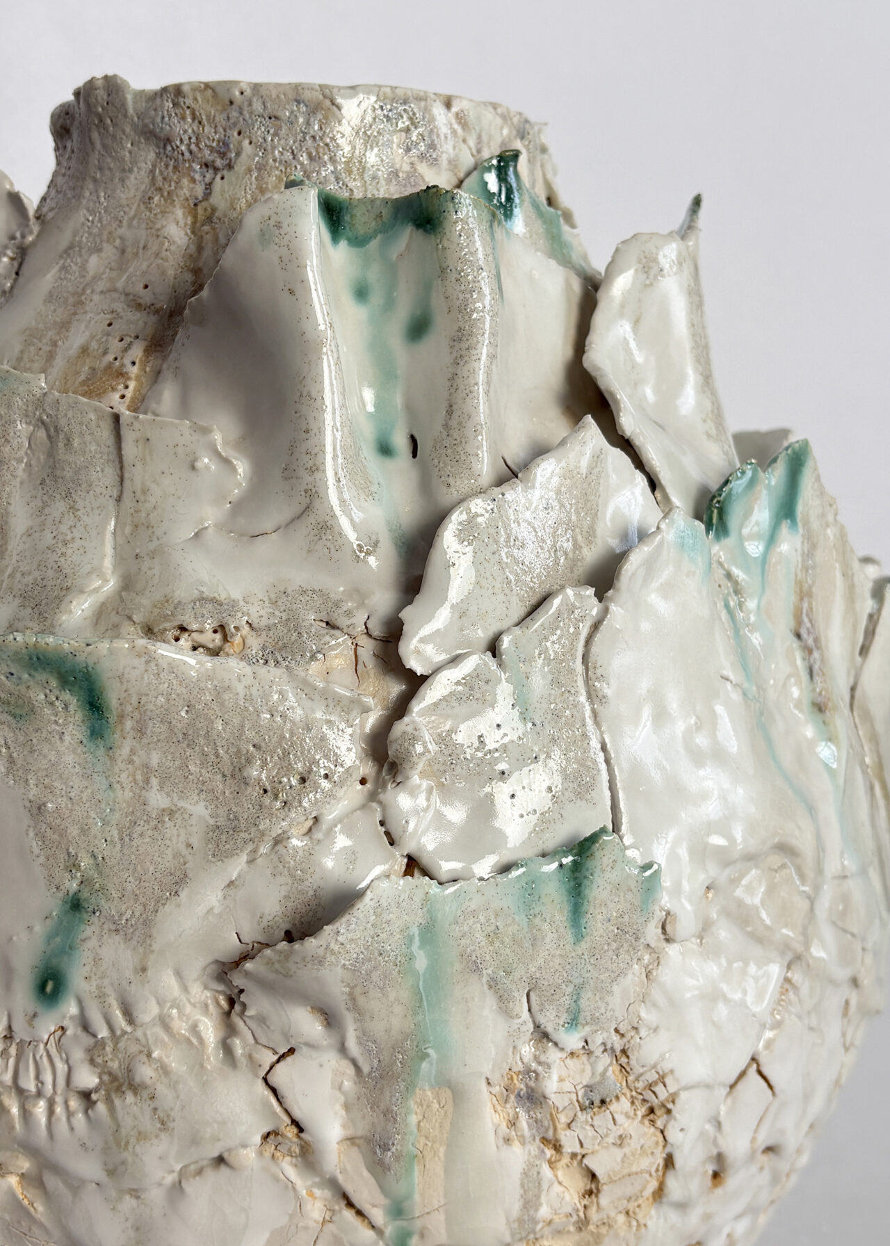 Closeup of vessel no 54 - Handbuilt stoneware ceramic vessel with cracked, blistered surface and layered oxide glaze by Rebeccah Pailes-Friedman