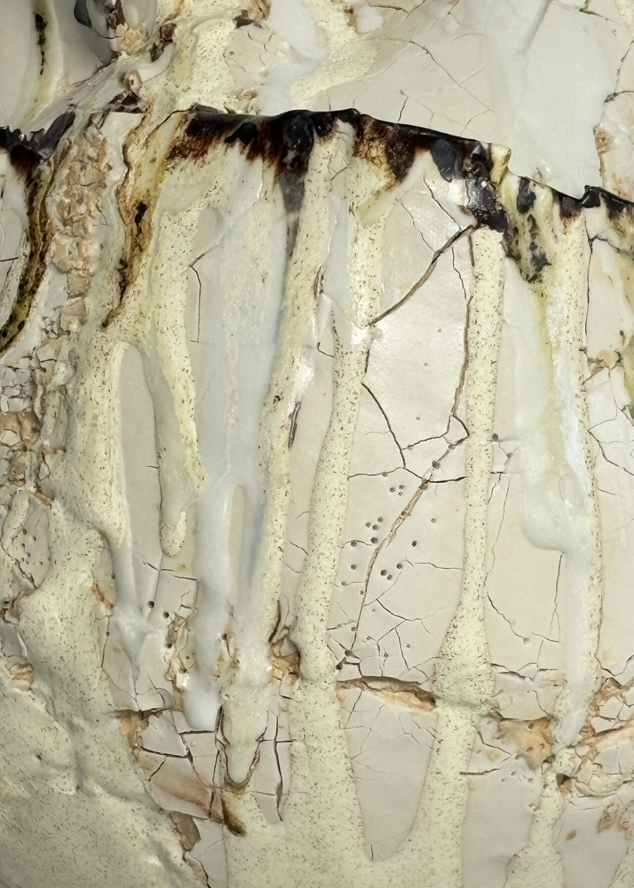 Close up of Vessel no. 55 - Handbuilt ceramic vessel with cracked textured surface and layered glaze by Rebeccah Pailes-Friedman