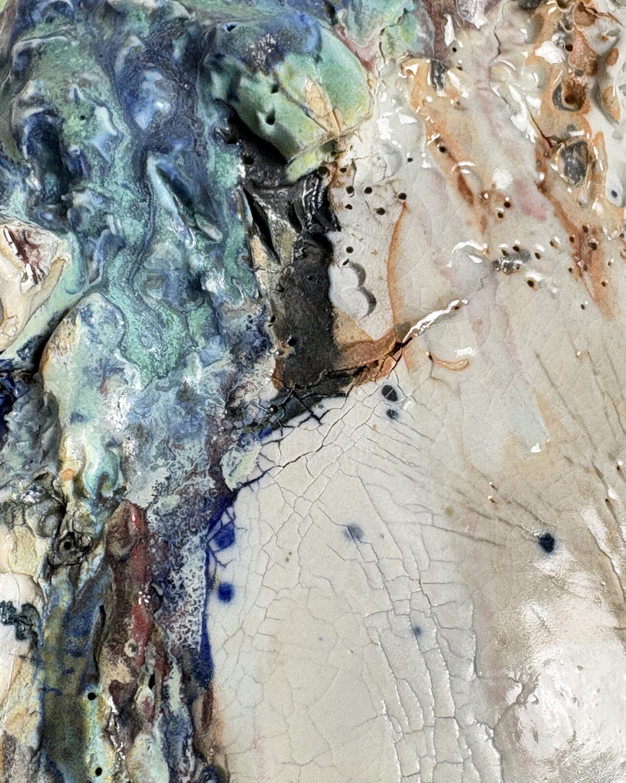 Vessel no. 66 - Shows the texture and colors of off this vessel. Colors are white, blue and turquoise with rust red areas in the cracked surface